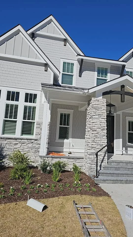 White seamless gutter installation along a Lowcountry rooftop in Beaufort, South Carolina